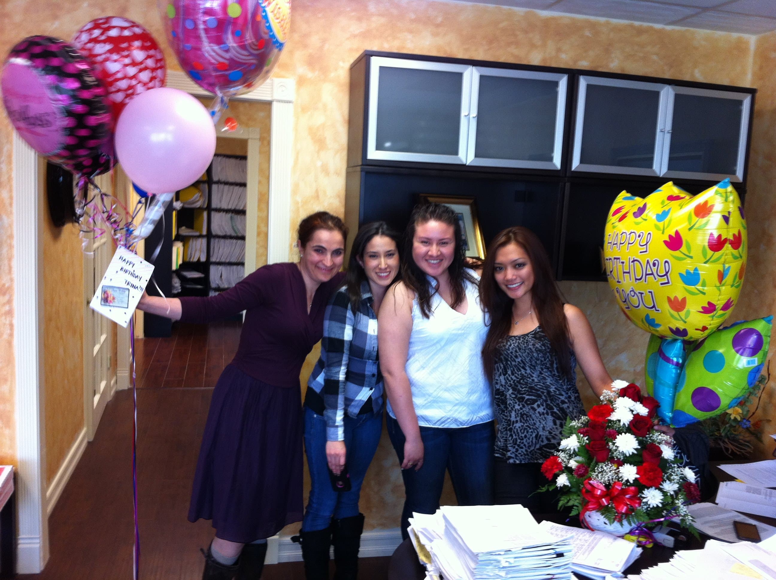 The Transcounty Associates team celebrating a birthday together in the office